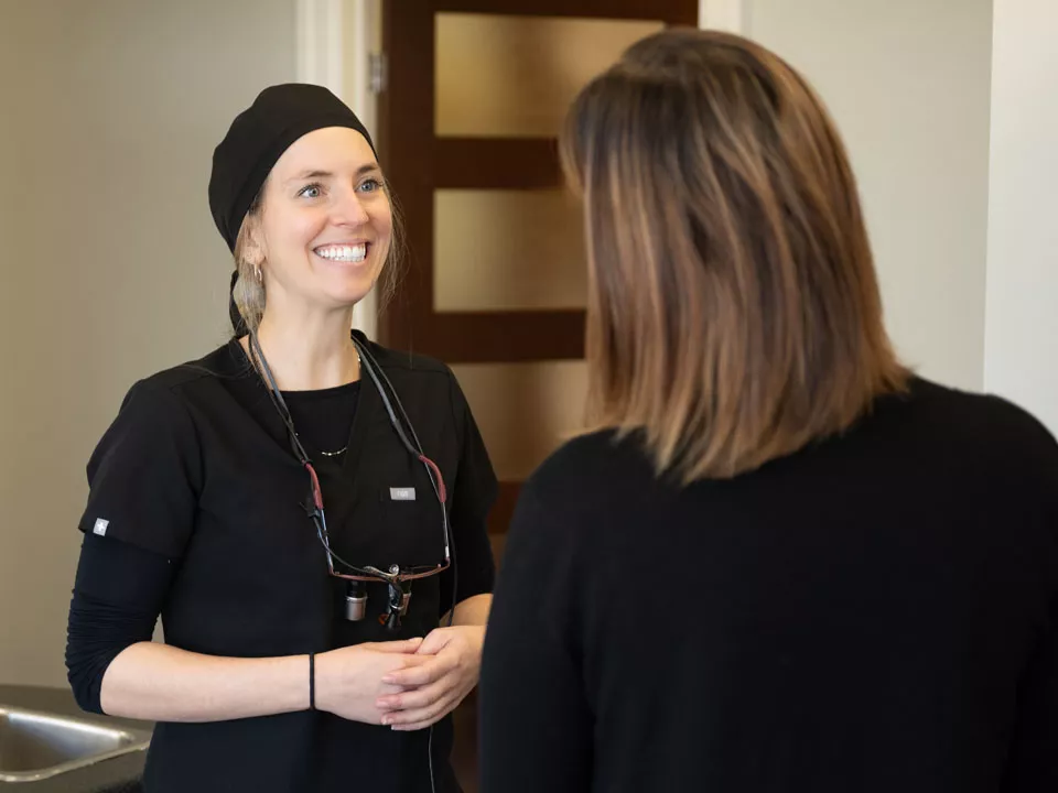 Dr. Gauthier conversing with patient