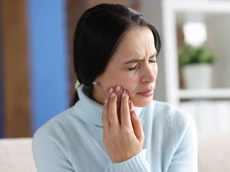 Woman experiencing tooth pain